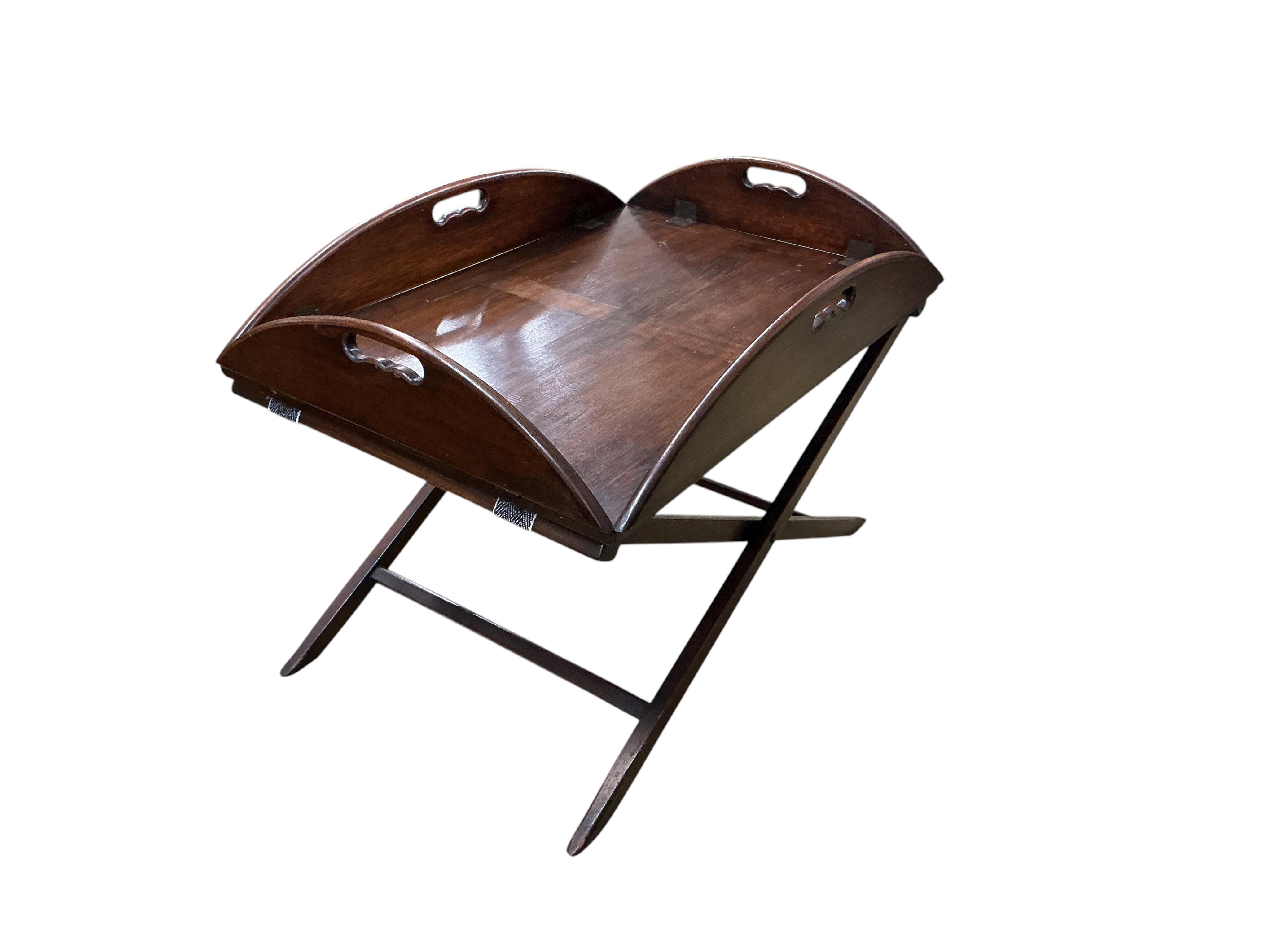 A reproduction Victorian style mahogany butler's tray on folding stand, width 82cm, depth 57cm, height 58cm